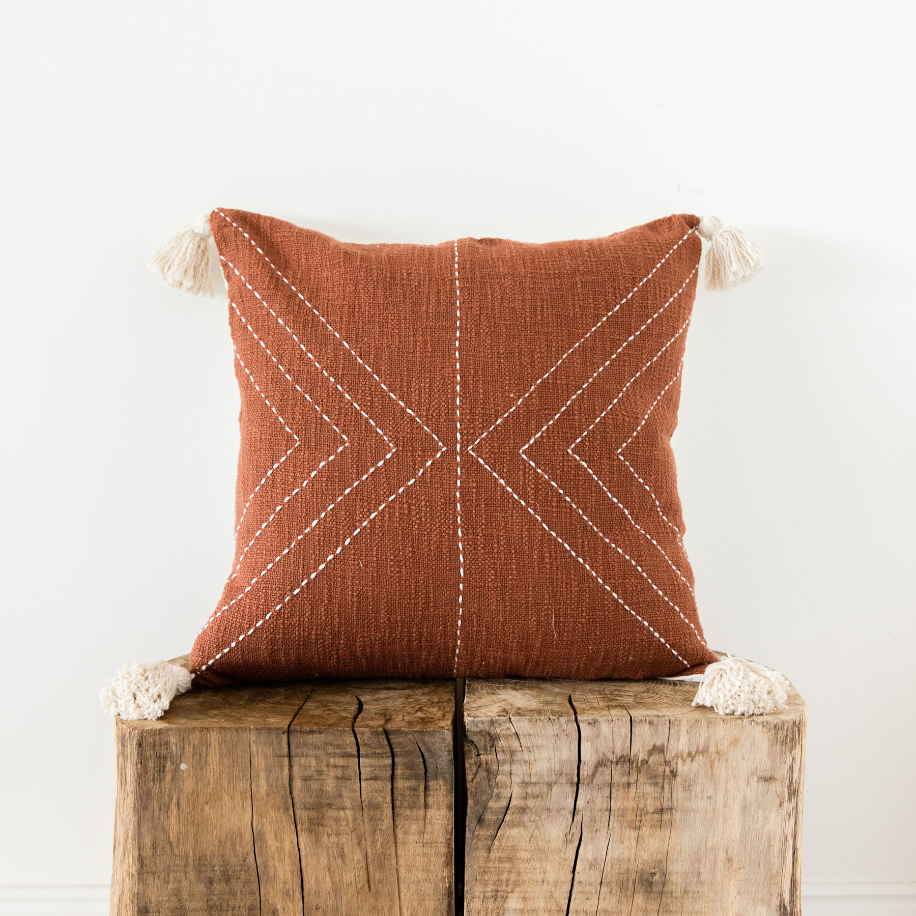 The Painted Bird Terracotta Cushion With Cream Stitched Pattern