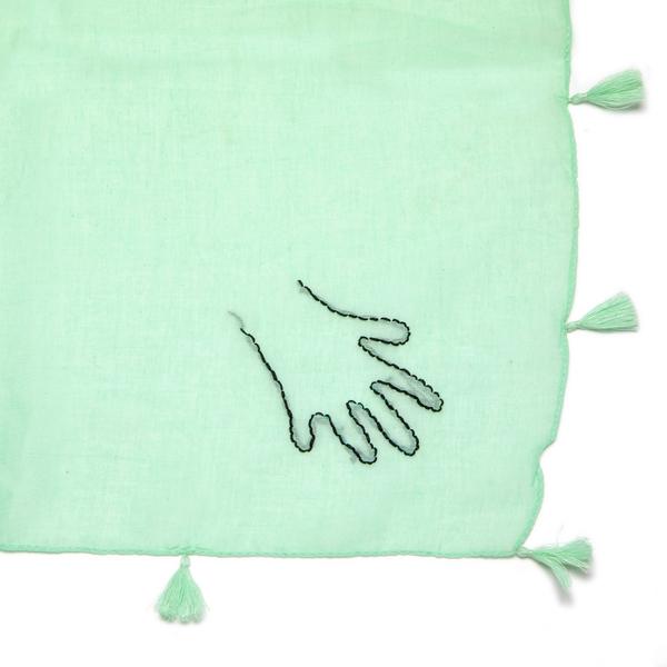 Green hand embroidery hand