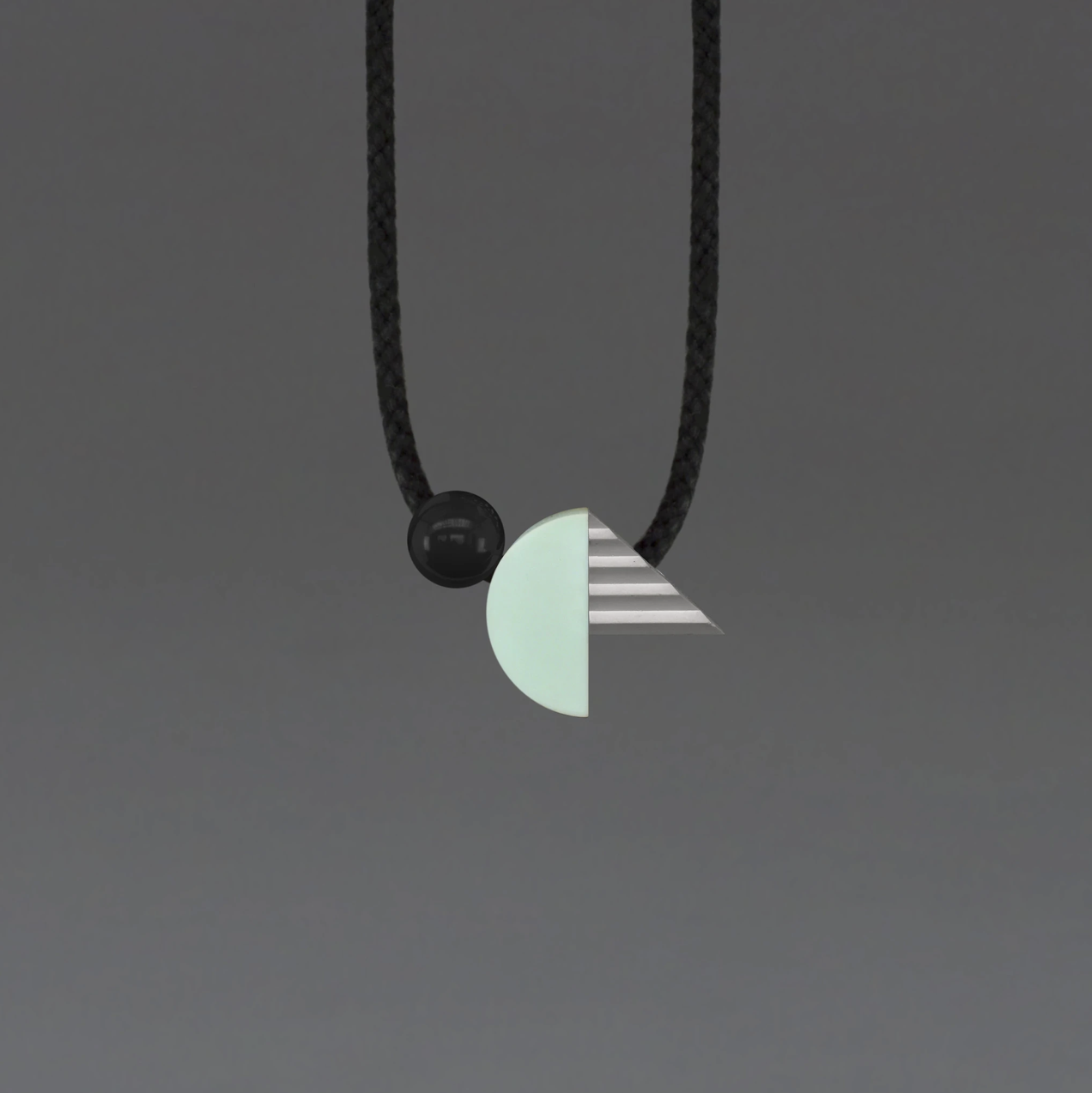 One We Made Earlier Kupka Geometric Necklace with Grey Triangle, Mint Curve and Black Resin Ball