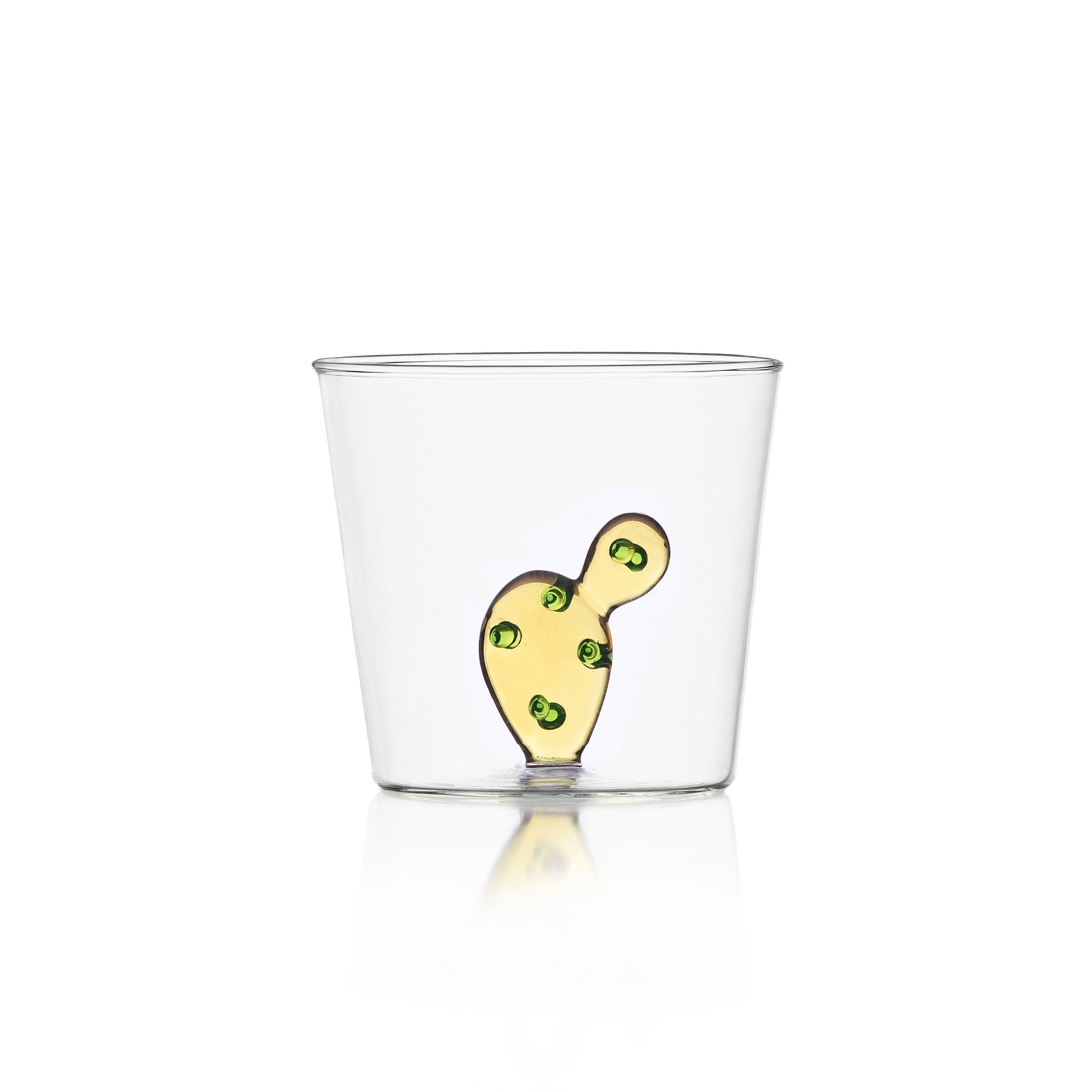 Water glass with amber colorful cactus and green dots