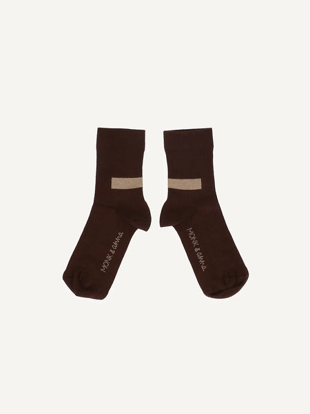monk-and-anna-socks-graphic-shape-dark-wood