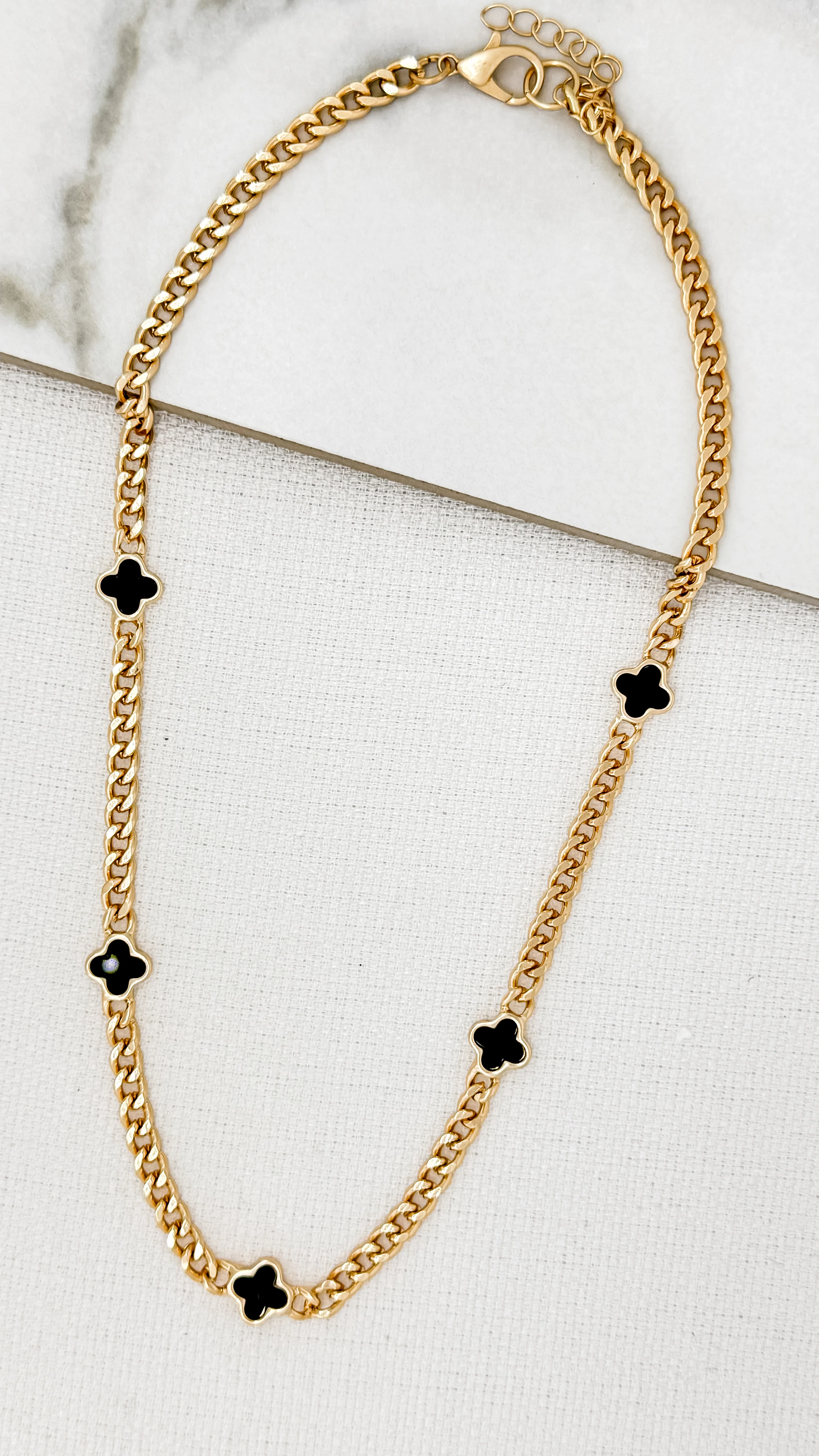 Envy Short Gold Curb Chain Necklace with 5 Black Fleurs