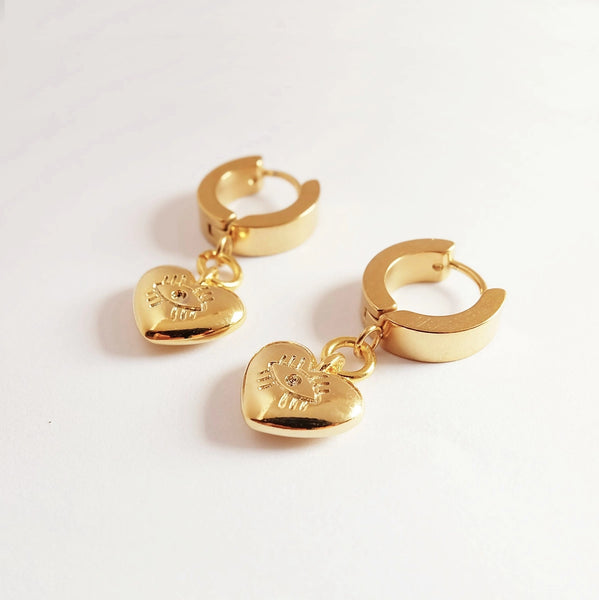 Augusta Jewellery | Evil Eye Heart Charm Huggie Hoop Earrings | Gold