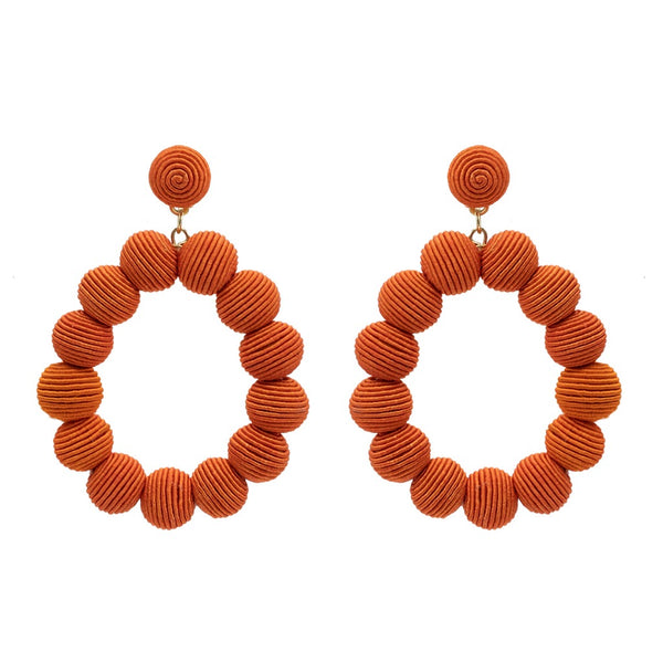 Narratives The Agency Coral Woven Ball Oval Earrings