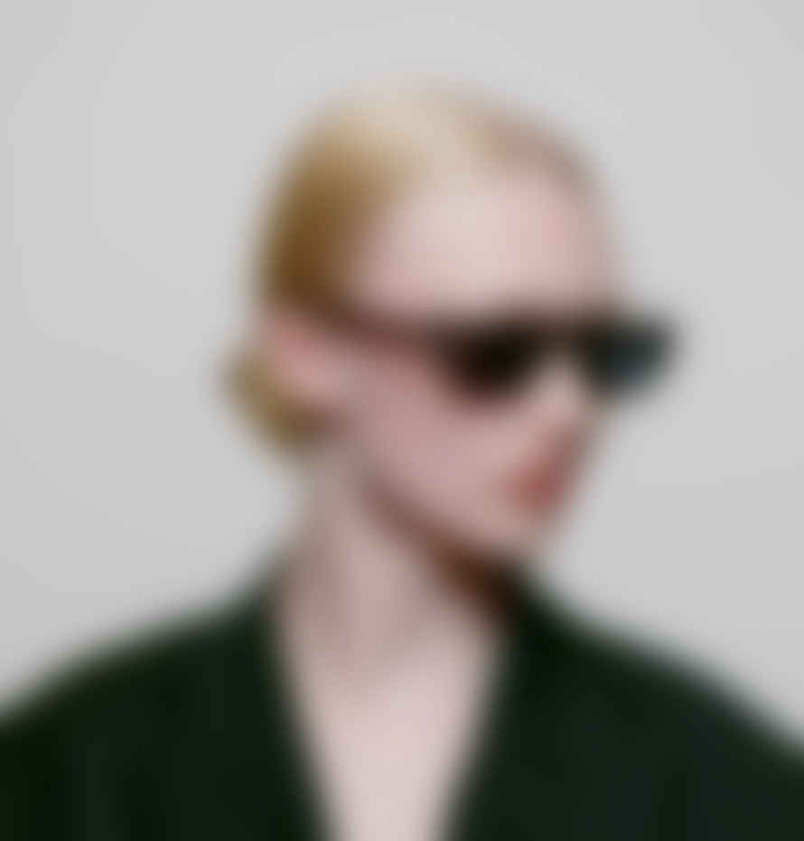 A Kjærbede Grey Transparent Jean Sunglasses.